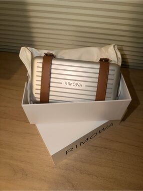 RIMOWA Silver Toiletry Pouch with Brown Leather Straps